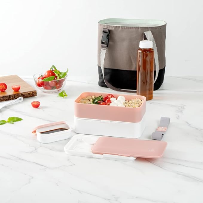 Restaurantware Bento Tek 40.5 Ounces Stackable Lunch Box 1 Reusable Adult Lunch Container - With Utensils Included Sauce Cup Pink & White Plastic Layered Lunch Box Microwavable Dishwashable