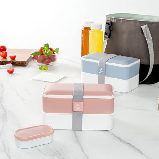 Restaurantware Bento Tek 40.5 Ounces Stackable Lunch Box 1 Reusable Adult Lunch Container - With Utensils Included Sauce Cup Pink & White Plastic Layered Lunch Box Microwavable Dishwashable