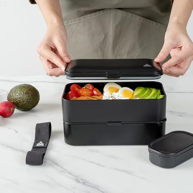 Restaurantware Bento Tek 40.5 Ounces Stackable Lunch Box 1 Reusable Adult Lunch Container - With Utensils Included Sauce Cup Black Plastic Layered Lunch Box Microwavable Dishwashable