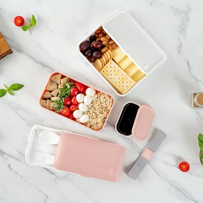 Restaurantware Bento Tek 40.5 Ounces Stackable Lunch Box 1 Reusable Adult Lunch Container - With Utensils Included Sauce Cup Pink & White Plastic Layered Lunch Box Microwavable Dishwashable