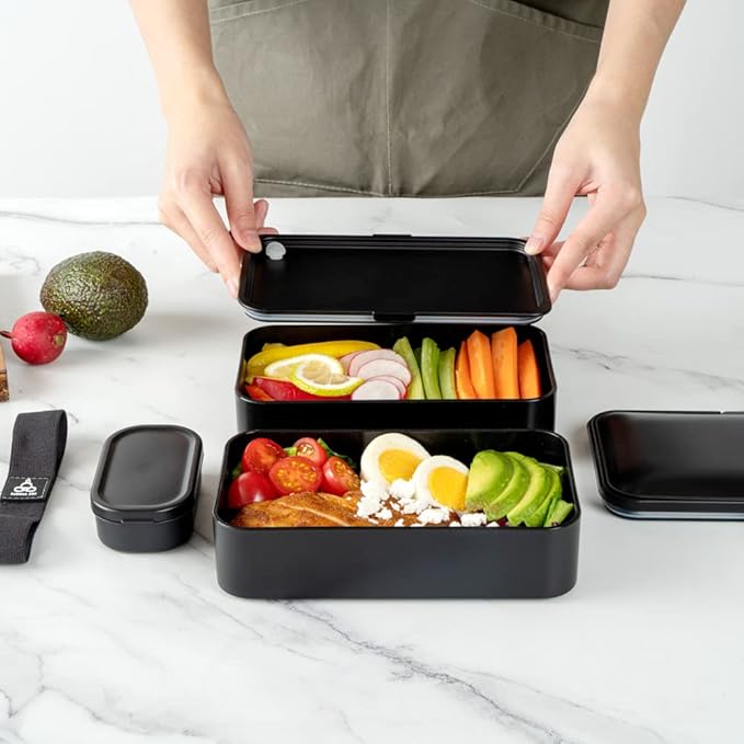 Restaurantware Bento Tek 40.5 Ounces Stackable Lunch Box 1 Reusable Adult Lunch Container - With Utensils Included Sauce Cup Black Plastic Layered Lunch Box Microwavable Dishwashable